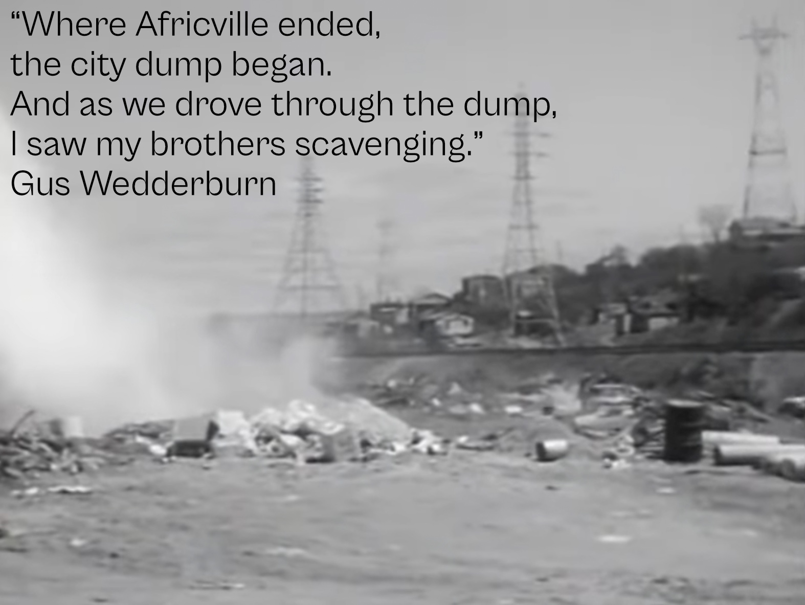 A photo of the city dump, with Africville visible behind clouds of dust (Remember Africville, 00:06:45).